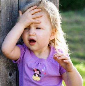 little girl hand to head